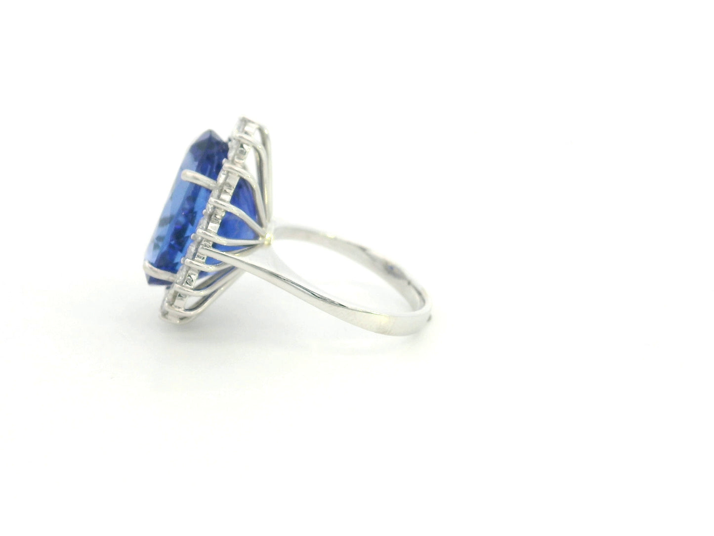 18K white gold oval tanzanite statement ring with diamond halo and 16.11 carat tanzanite by Emirates Diamonds