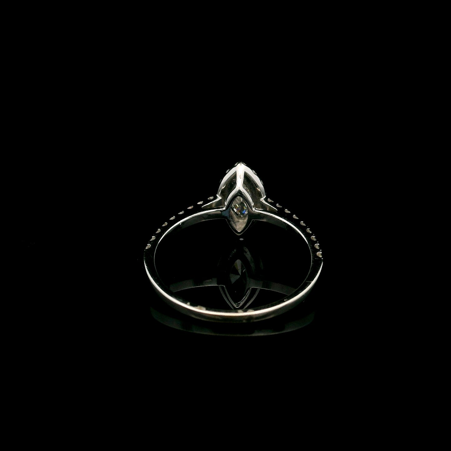 18K white gold marquise diamond halo engagement ring with diamond band featuring a 0.29 carat natural marquise cut centre diamond.