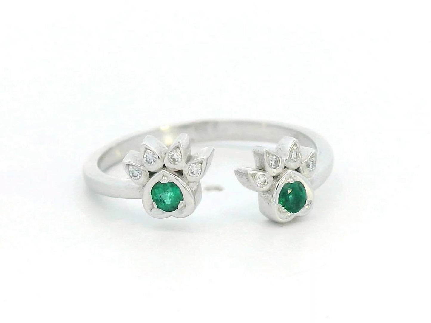 18K gold open band ring with emerald and diamond paw motifs