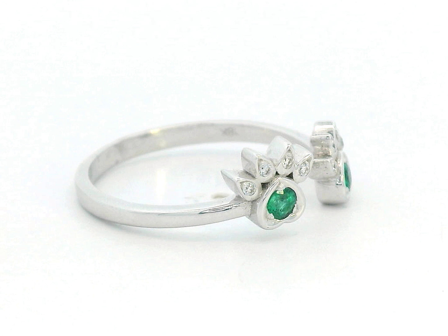 18K gold open band ring with emerald and diamond paw motifs