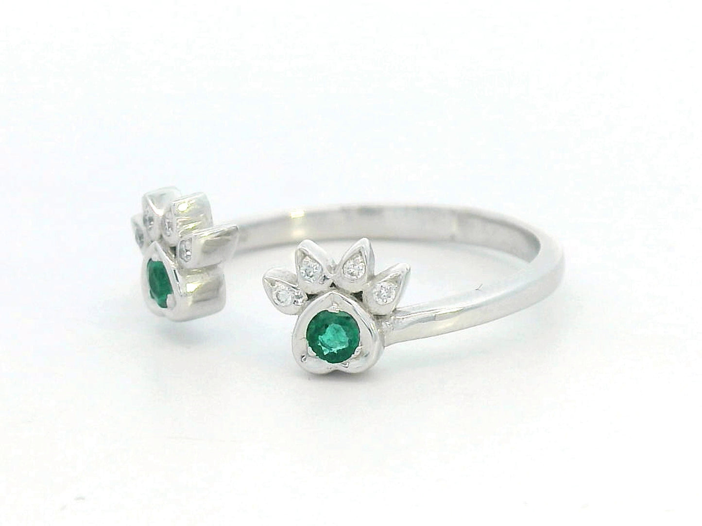 18K gold open band ring with emerald and diamond paw motifs