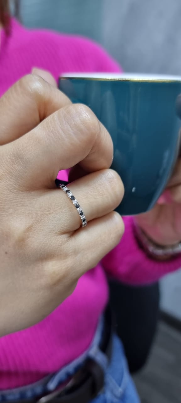 18K rose gold black and white diamond eternity ring featuring 0.45ct of diamonds in a half-eternity wedding band style, perfect for stacking or as a unique wedding ring.