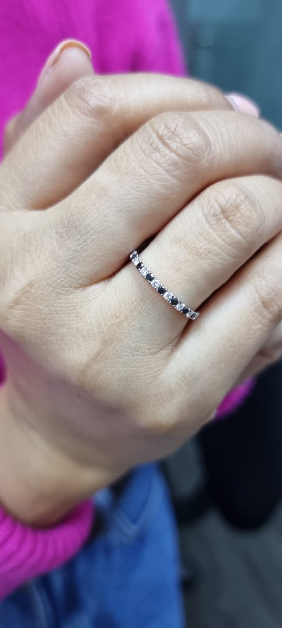 18K rose gold black and white diamond eternity ring featuring 0.45ct of diamonds in a half-eternity wedding band style, perfect for stacking or as a unique wedding ring.