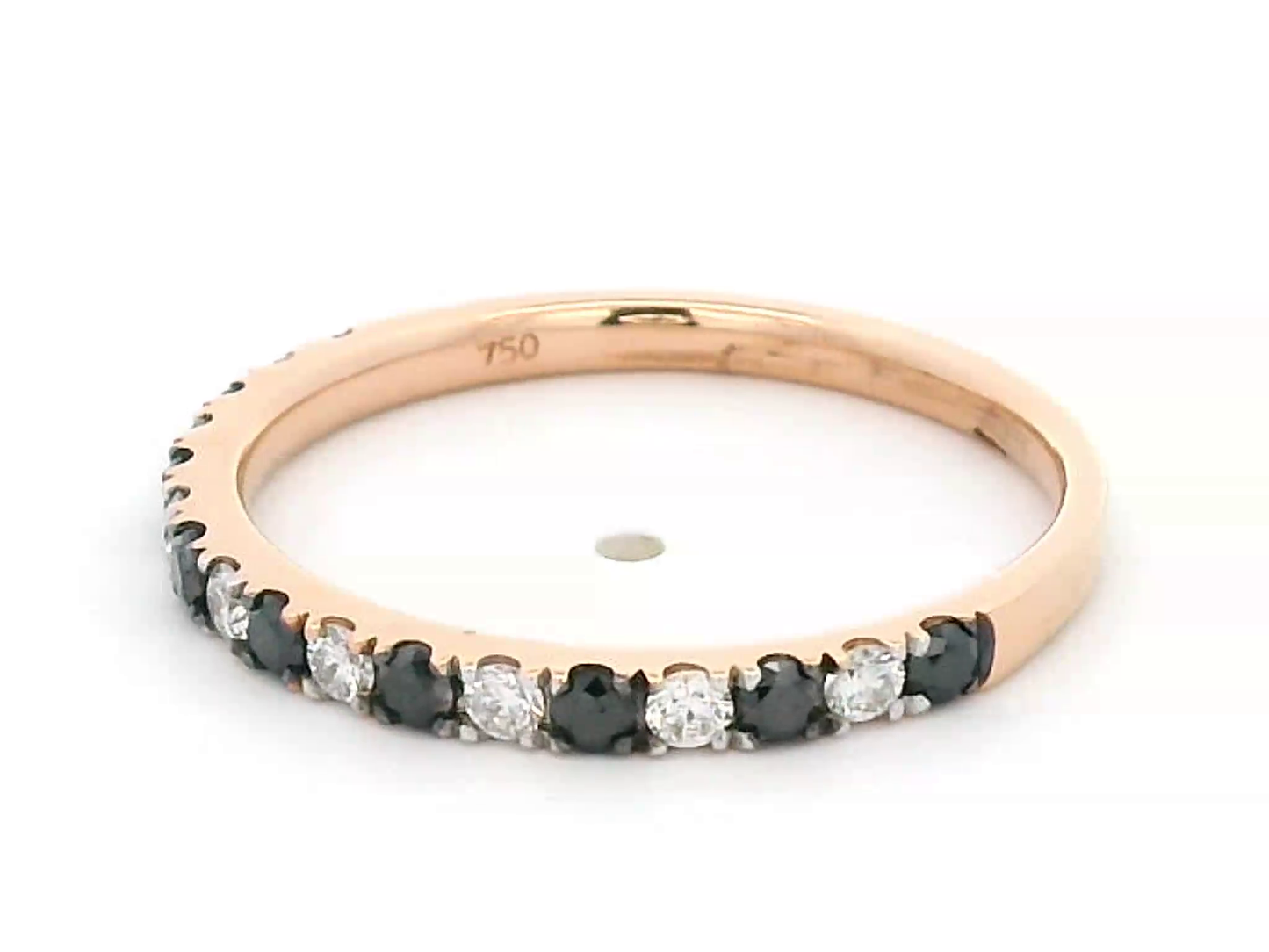18K rose gold black and white diamond eternity ring featuring 0.45ct of diamonds in a half-eternity wedding band style, perfect for stacking or as a unique wedding ring.