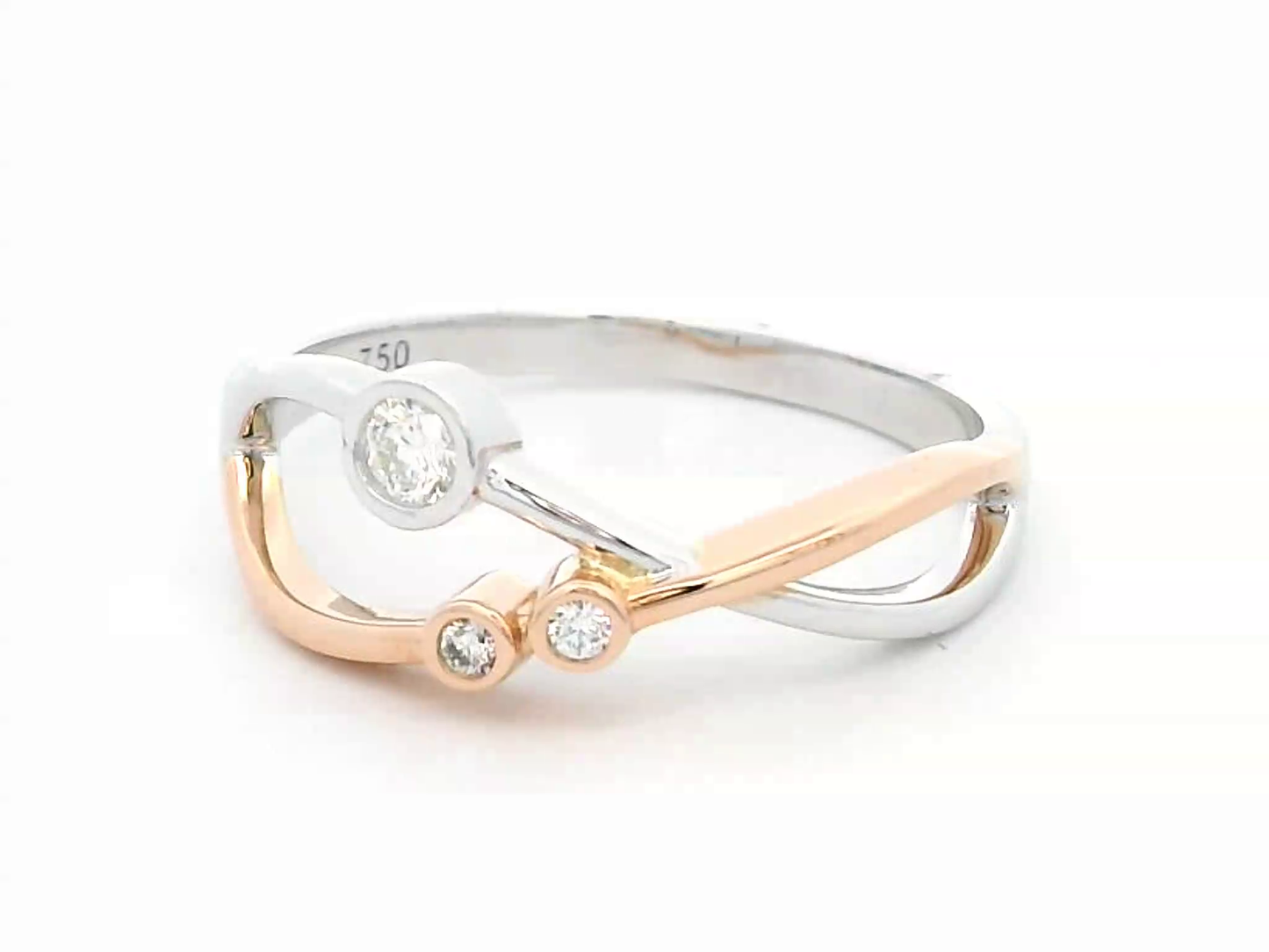 18K two-tone gold open-design ring featuring three bezel-set round diamonds totaling 0.11 carats, with an artistic blend of white and rose gold.