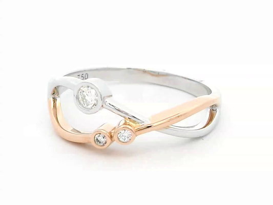 18K two-tone gold open-design ring featuring three bezel-set round diamonds totaling 0.11 carats, with an artistic blend of white and rose gold.
