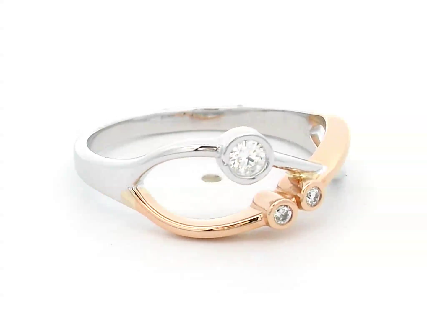 18K two-tone gold open-design ring featuring three bezel-set round diamonds totaling 0.11 carats, with an artistic blend of white and rose gold.