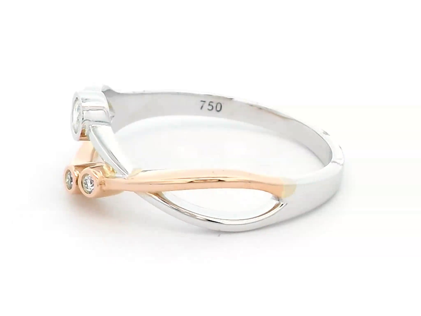 18K two-tone gold open-design ring featuring three bezel-set round diamonds totaling 0.11 carats, with an artistic blend of white and rose gold.