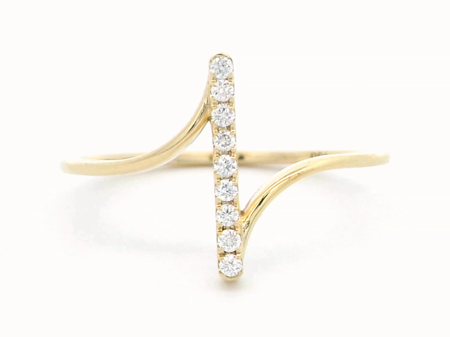 This striking 18k gold ring features a modern vertical bar design, set with brilliant round diamonds for an elegant touch of sparkle. The open ring style adds a unique flair, creating a sleek and minimalist look that is both contemporary and timeless. Perfect for stacking or as a statement piece on its own, this ring is available in yellow gold, offering a luxurious feel. Ideal for those who appreciate innovative designs and refined jewelry, this ring is a standout addition to any collection