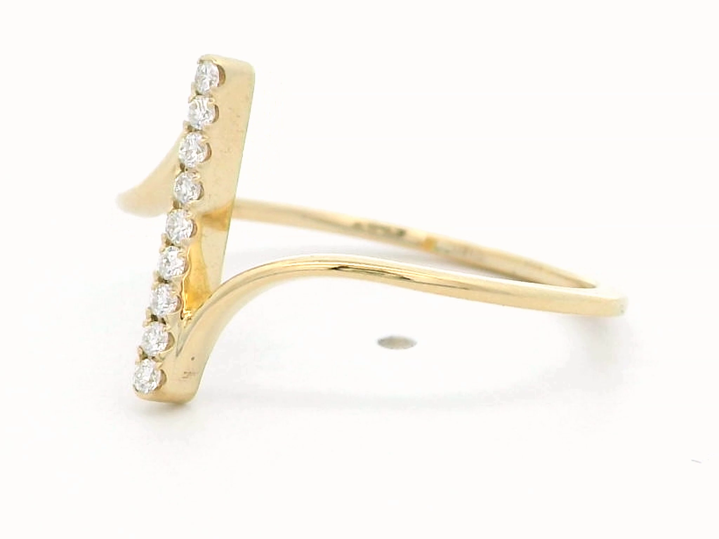 This striking 18k gold ring features a modern vertical bar design, set with brilliant round diamonds for an elegant touch of sparkle. The open ring style adds a unique flair, creating a sleek and minimalist look that is both contemporary and timeless. Perfect for stacking or as a statement piece on its own, this ring is available in yellow gold, offering a luxurious feel. Ideal for those who appreciate innovative designs and refined jewelry, this ring is a standout addition to any collection