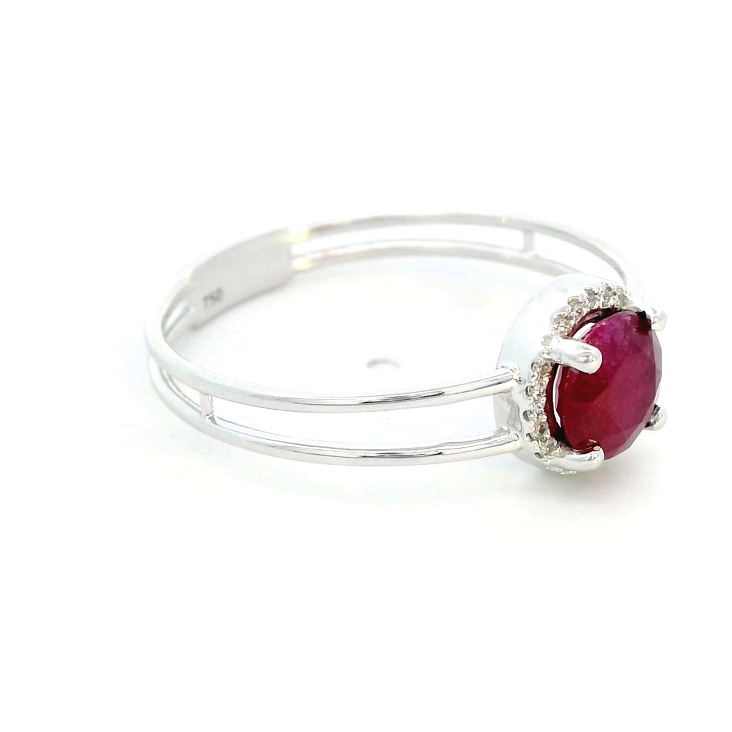 1.14 carat ruby and 0.05 carat diamond halo ring in 18K white gold with a modern double-band design.