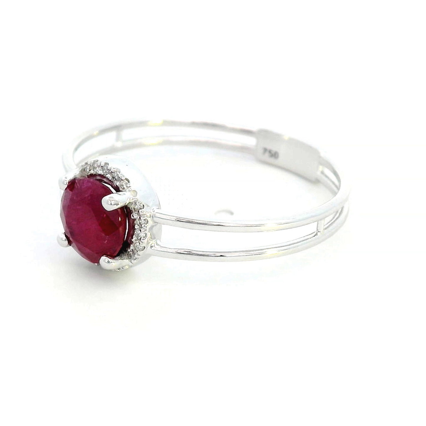 1.14 carat ruby and 0.05 carat diamond halo ring in 18K white gold with a modern double-band design.