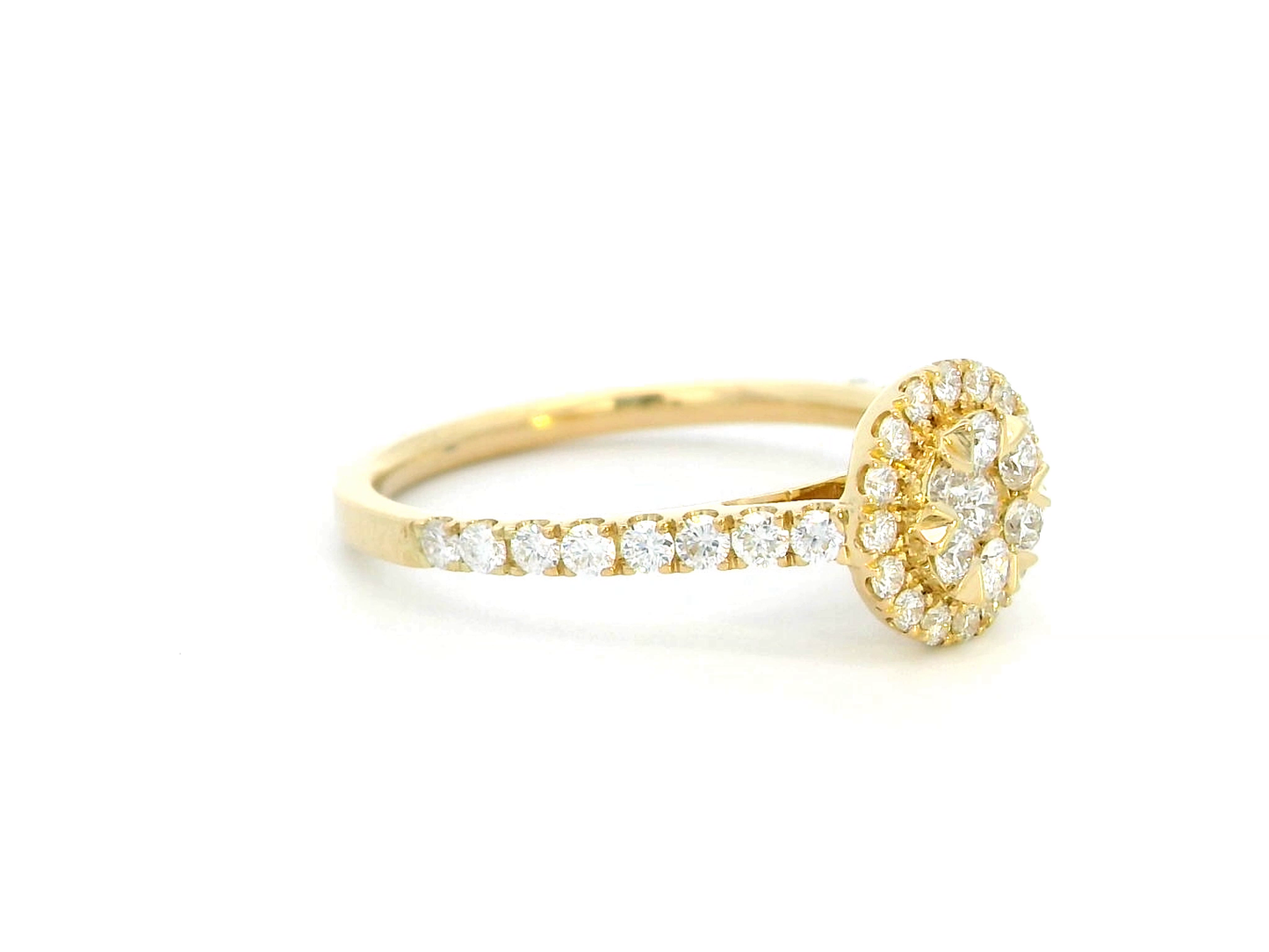Luxury 18K yellow gold diamond cluster ring, featuring 0.61 carats of round-cut diamonds in a floral-inspired vintage design.