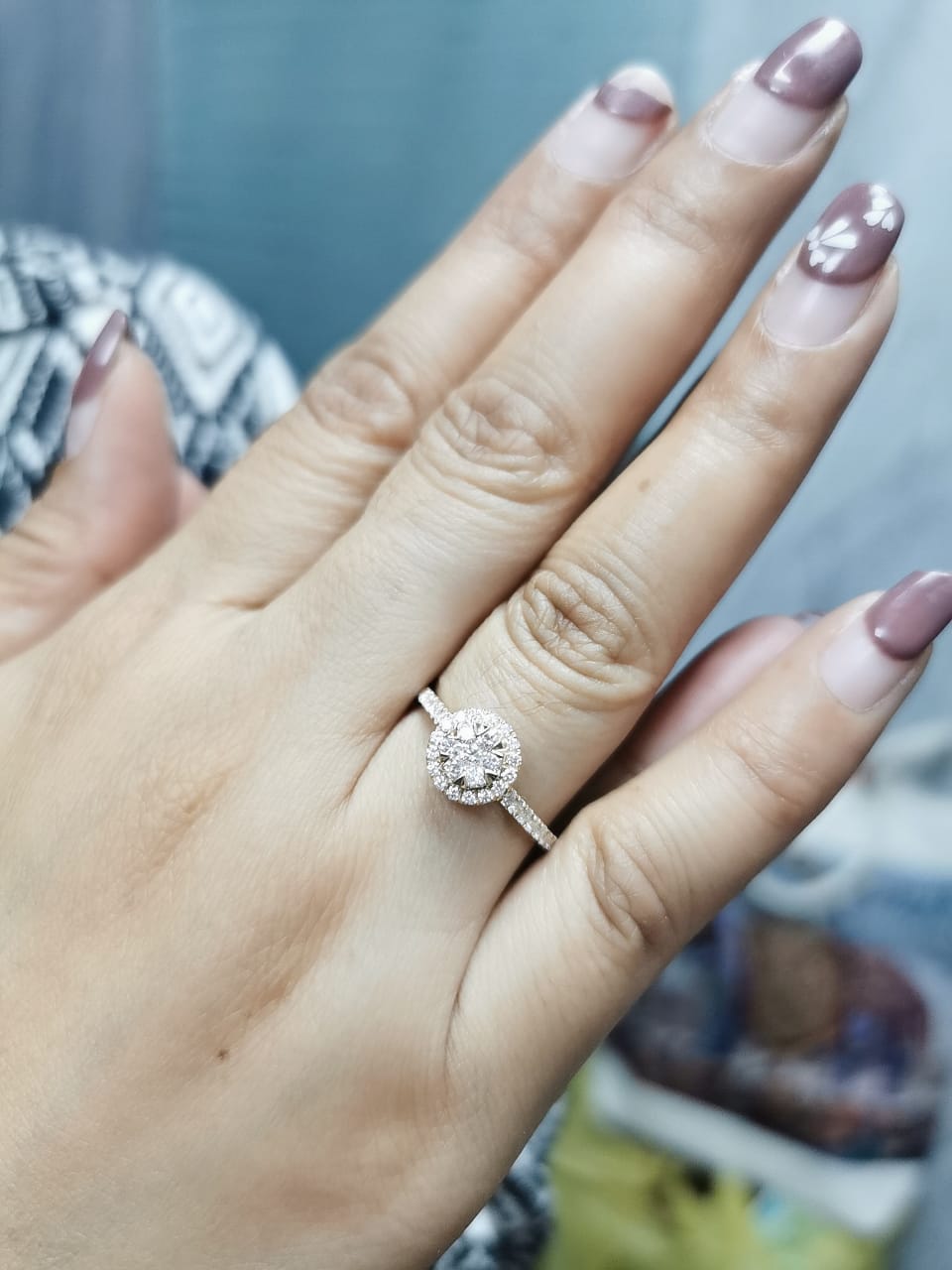 Luxury 18K yellow gold diamond cluster ring, featuring 0.61 carats of round-cut diamonds in a floral-inspired vintage design.