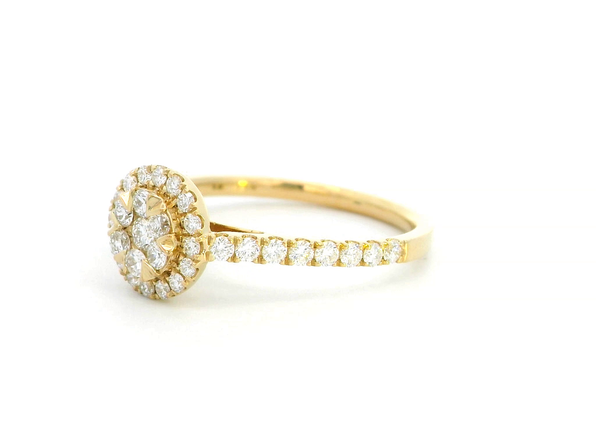 Luxury 18K yellow gold diamond cluster ring, featuring 0.61 carats of round-cut diamonds in a floral-inspired vintage design.