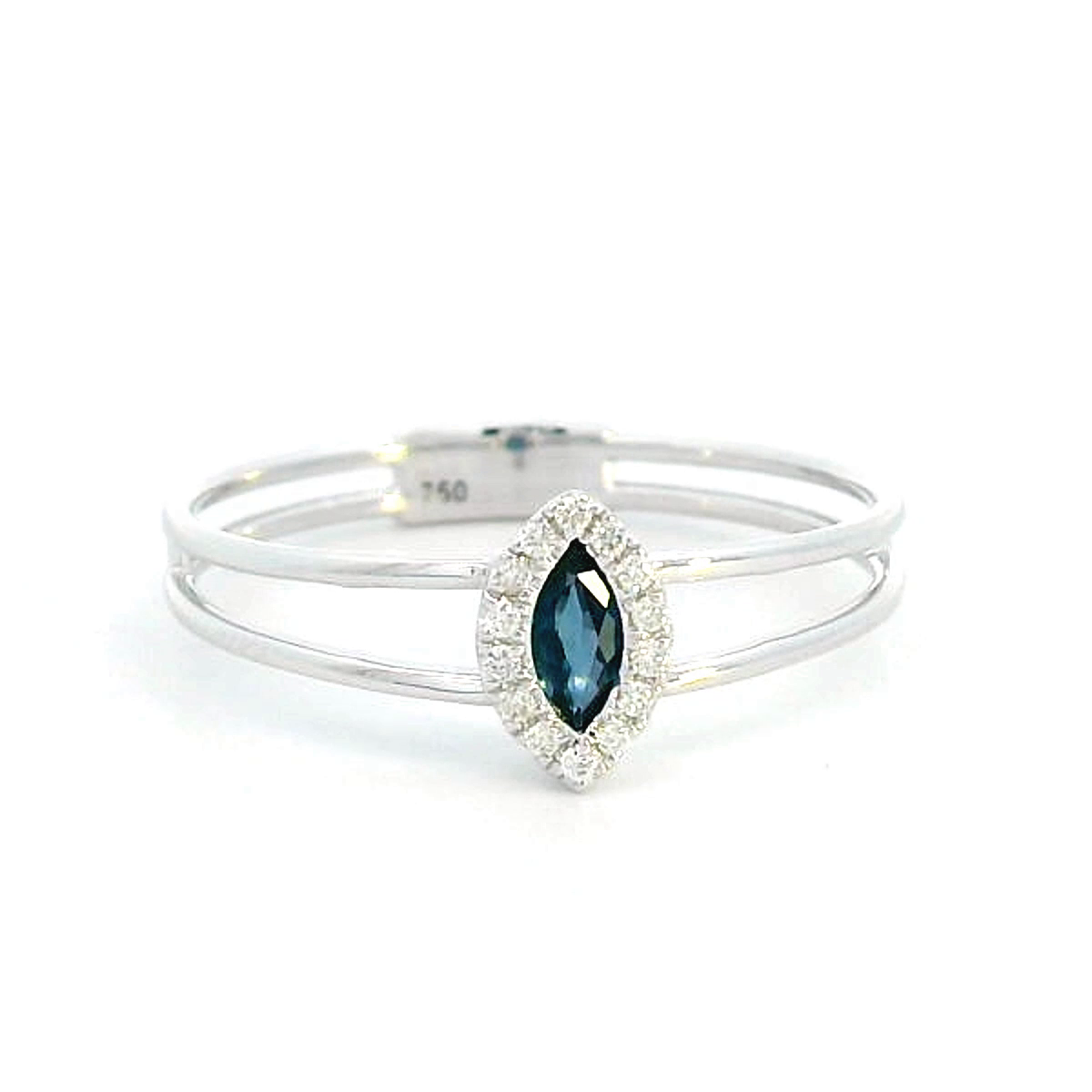 18K gold marquise-cut blue sapphire and diamond halo ring featuring a 0.16-carat blue sapphire, framed by 0.05 carats of diamonds, set in an elegant double-band design.