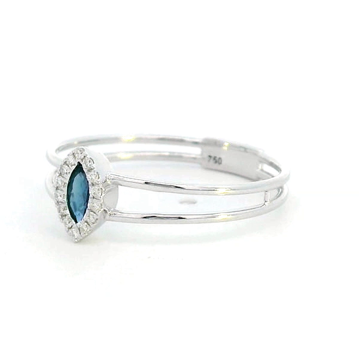 18K gold marquise-cut blue sapphire and diamond halo ring featuring a 0.16-carat blue sapphire, framed by 0.05 carats of diamonds, set in an elegant double-band design.