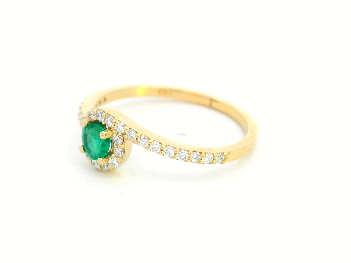18K yellow gold halo ring featuring a 0.22-carat round emerald surrounded by 0.25-carat diamonds on a diamond-accented band.