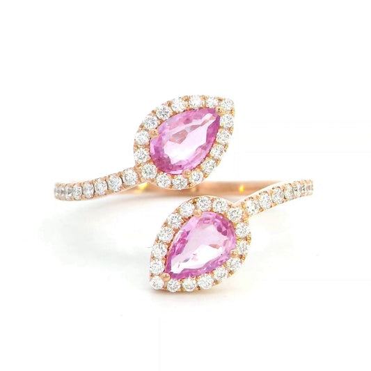 Toi et Moi ring in 18K rose gold with 1.44ct pear-shaped pink sapphires and 0.34ct diamond halo on a pavé band.