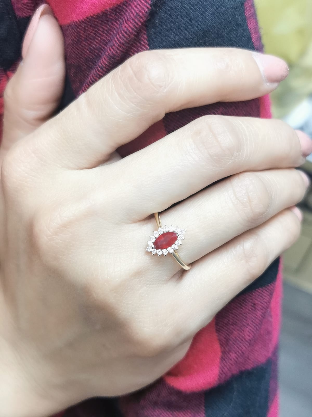 18K yellow gold marquise ruby ring with diamond halo"