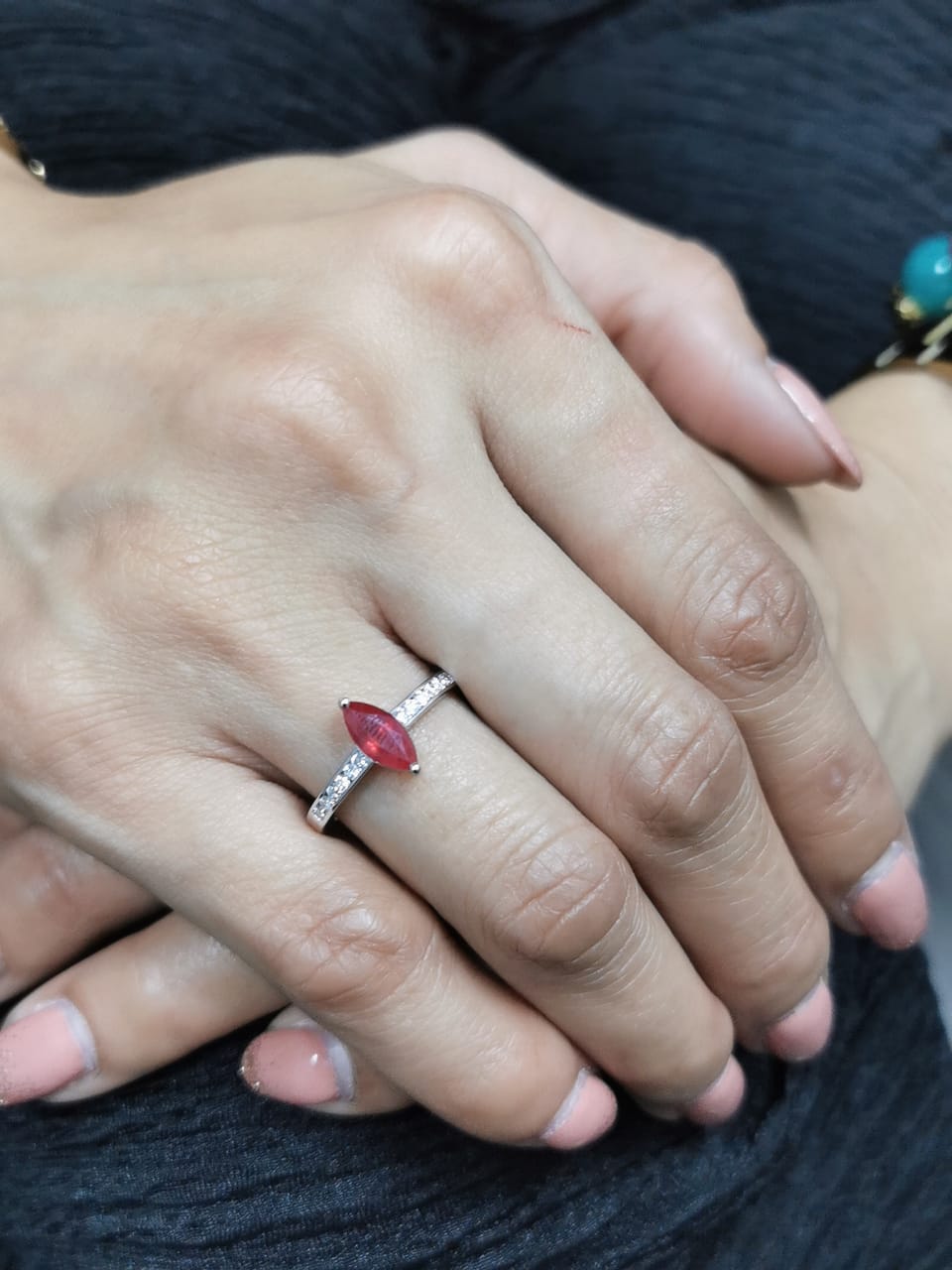18K white gold marquise ruby and diamond ring featuring a 0.97-carat ruby and 0.21 carats of diamonds, symbolizing the July birthstone.