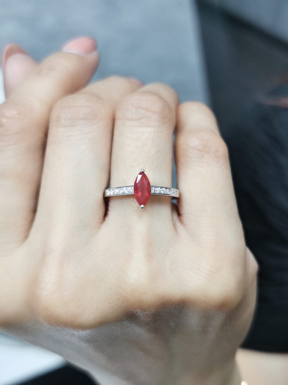18K white gold marquise ruby and diamond ring featuring a 0.97-carat ruby and 0.21 carats of diamonds, symbolizing the July birthstone.