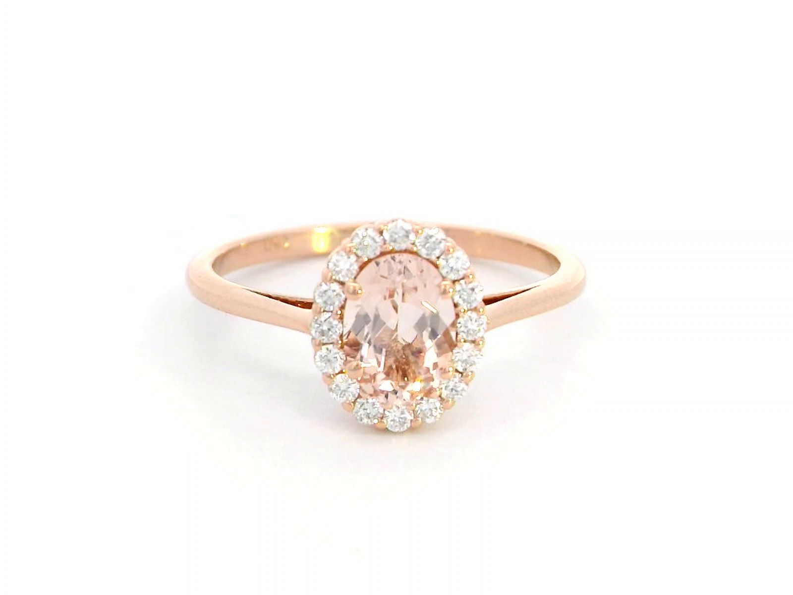18K rose gold ring featuring a 0.64-carat oval peachy pink morganite, surrounded by a sparkling diamond halo with a total weight of 0.17 carats, showcasing an elegant and polished design.