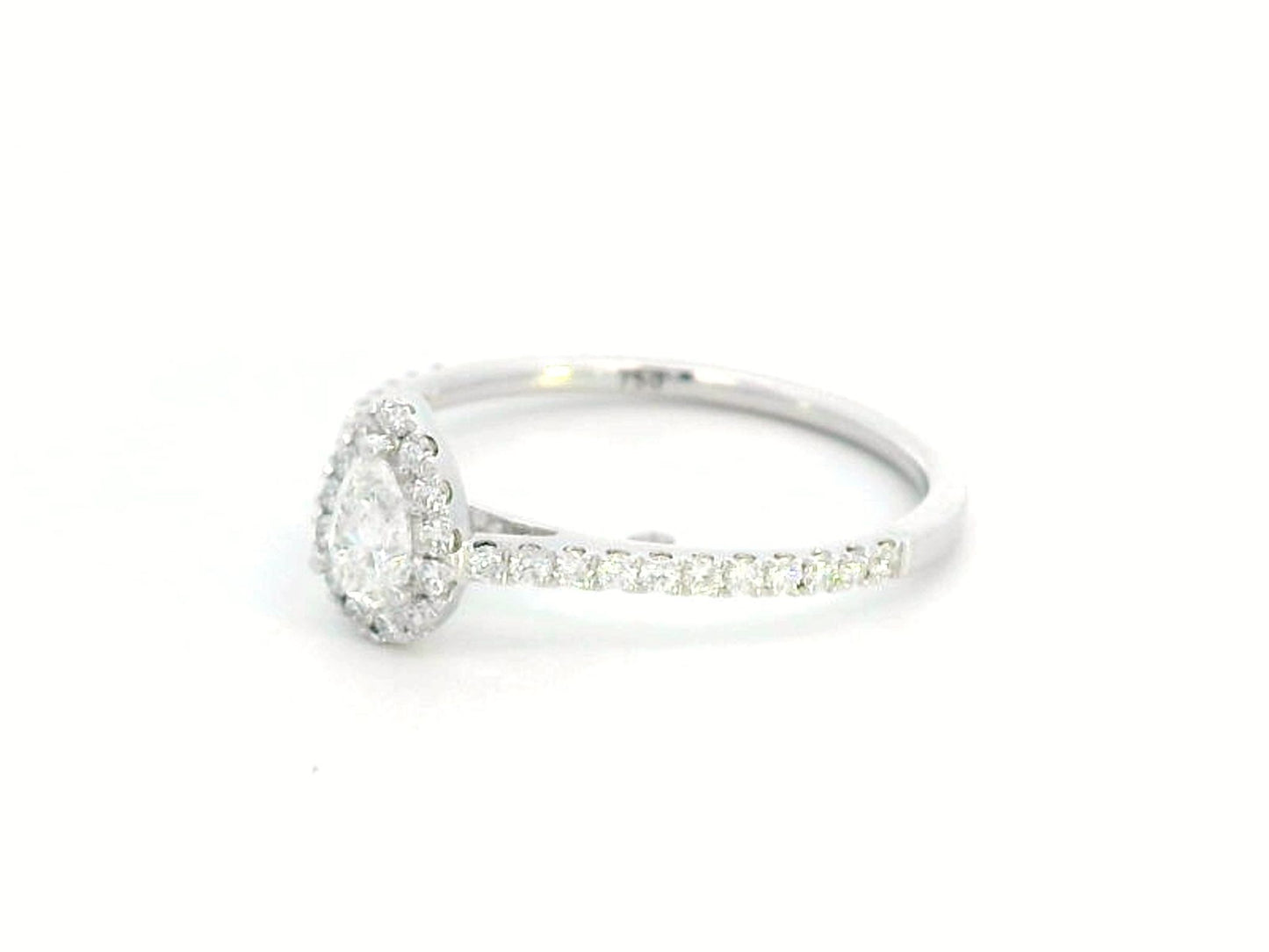 18K gold pear-cut diamond halo engagement ring with a 0.25ct center stone and accent diamonds on a delicate band.