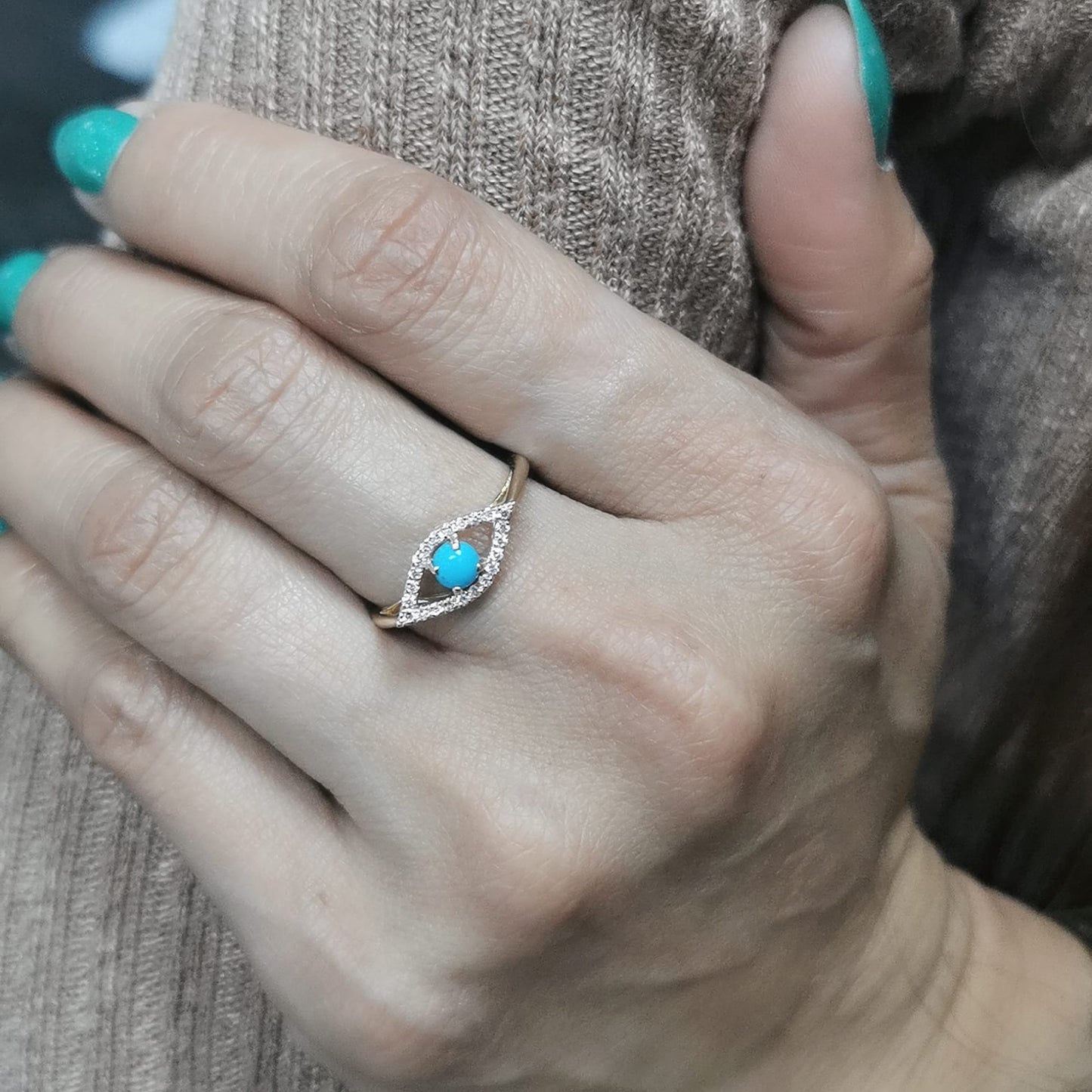 18K gold Evil Eye ring featuring a 0.32-carat turquoise center stone with a 0.15-carat diamond halo. Symbolic and stylish, perfect for stacking.