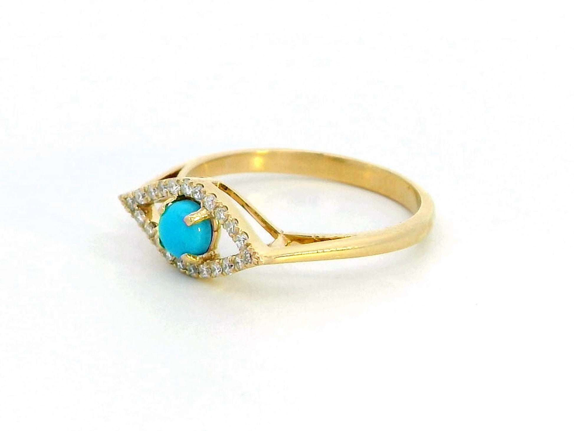18K gold Evil Eye ring featuring a 0.32-carat turquoise center stone with a 0.15-carat diamond halo. Symbolic and stylish, perfect for stacking.