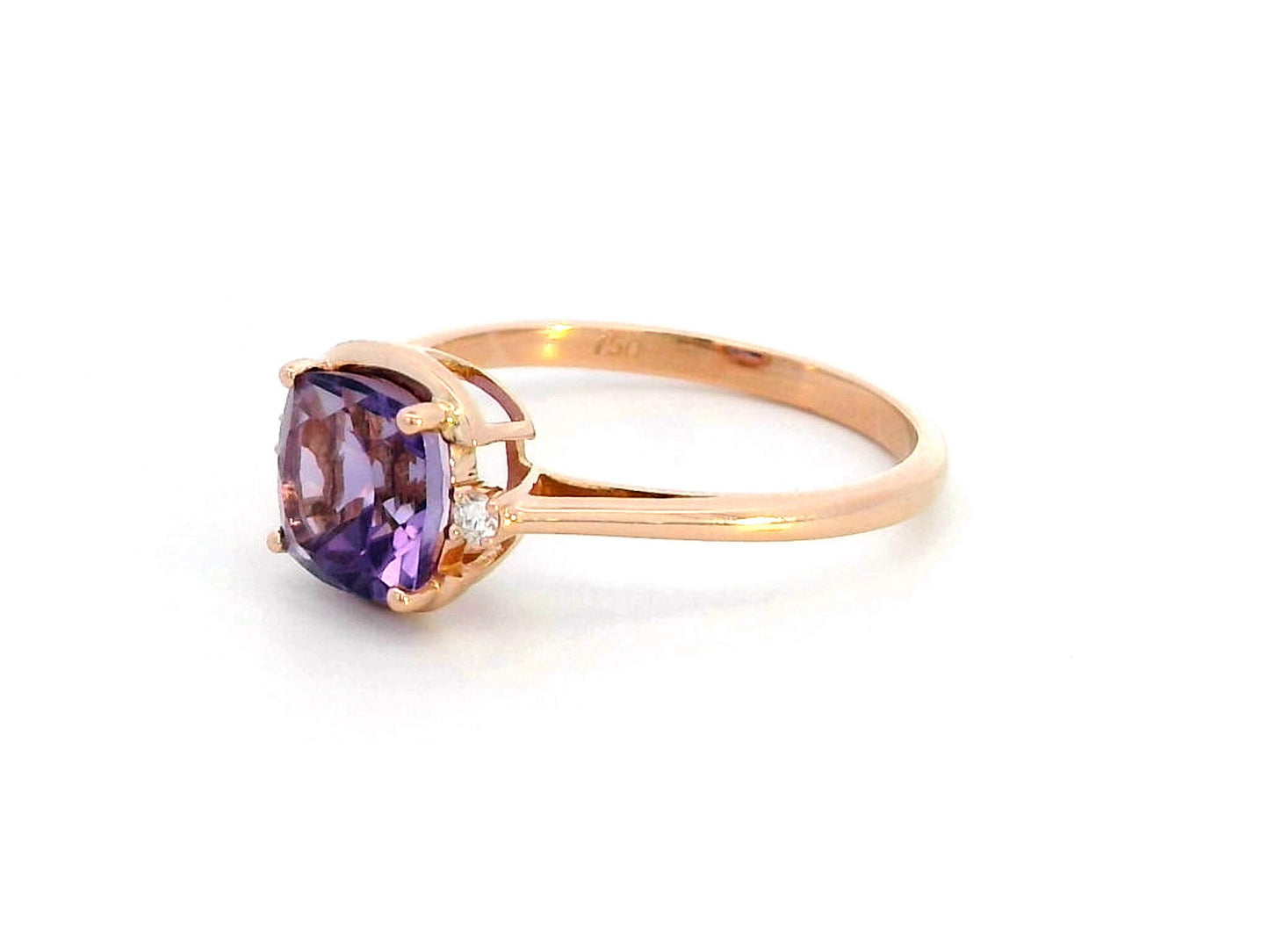 18K gold ring with a 1.51-carat cushion-cut purple amethyst center stone, accented by two round diamonds totaling 0.04 carat.
