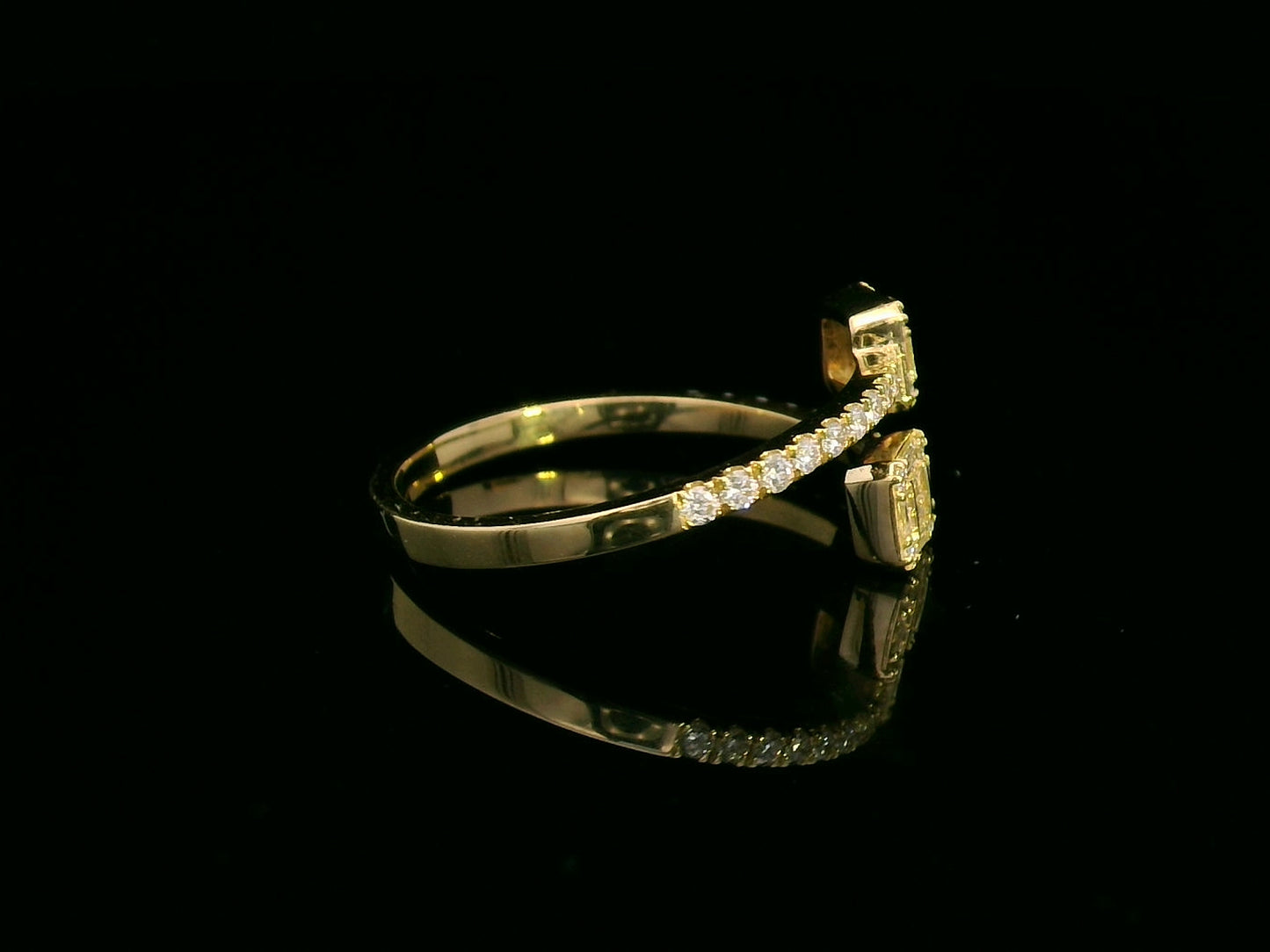 18K gold open ring with 0.34 carat baguette and round diamonds, elegant and modern jewelry piece.