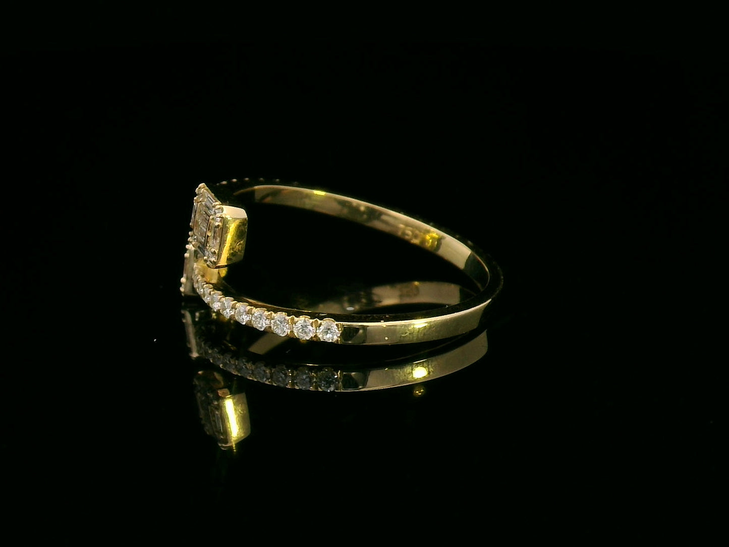 18K gold open ring with 0.34 carat baguette and round diamonds, elegant and modern jewelry piece.