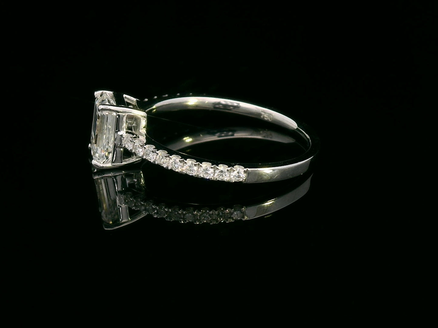 Emerald-cut diamond engagement ring in 18K white gold with D-color VVS1 GIA-certified center stone and pave band – Emirates Diamonds.