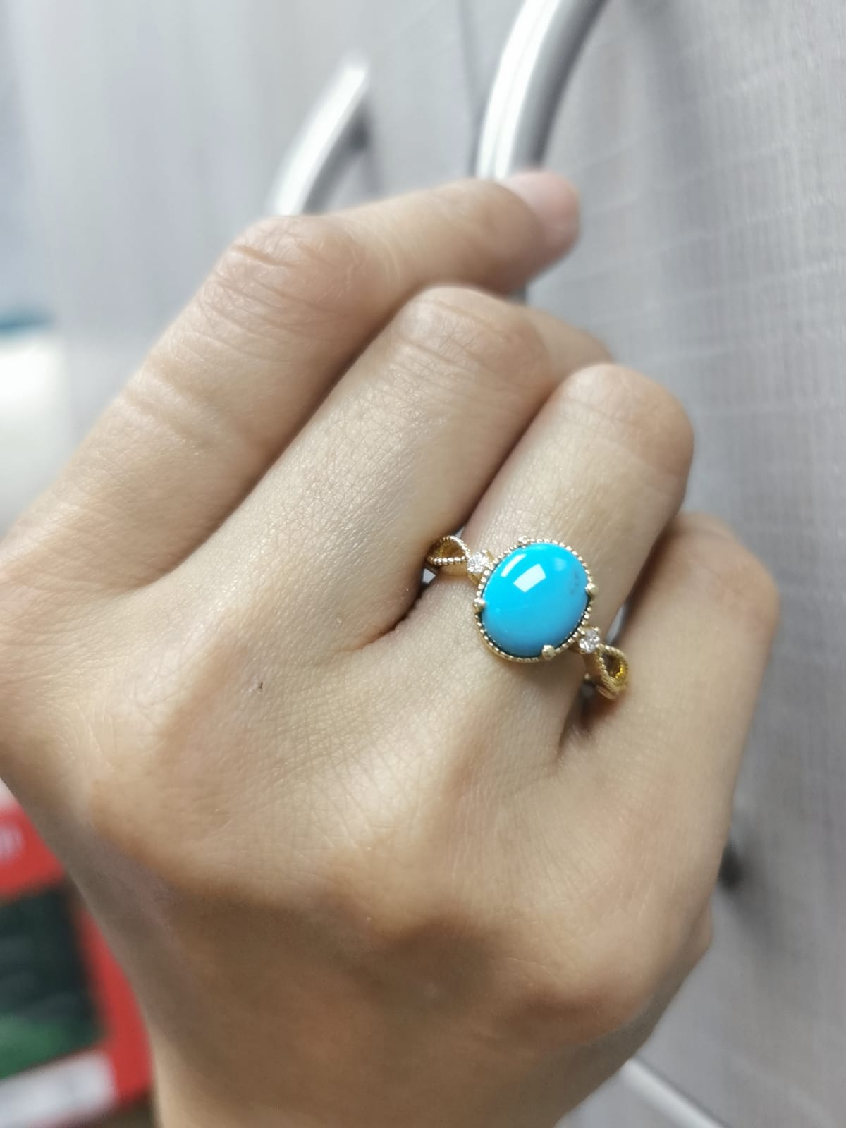 18K gold oval turquoise ring with diamond accents and vintage milgrain openwork design