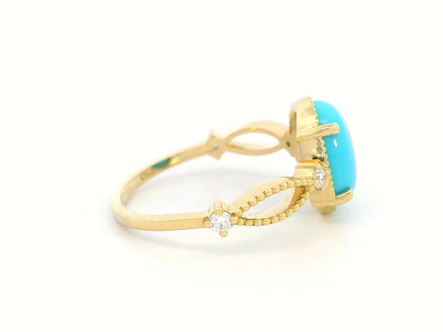 18K gold oval turquoise ring with diamond accents and vintage milgrain openwork design