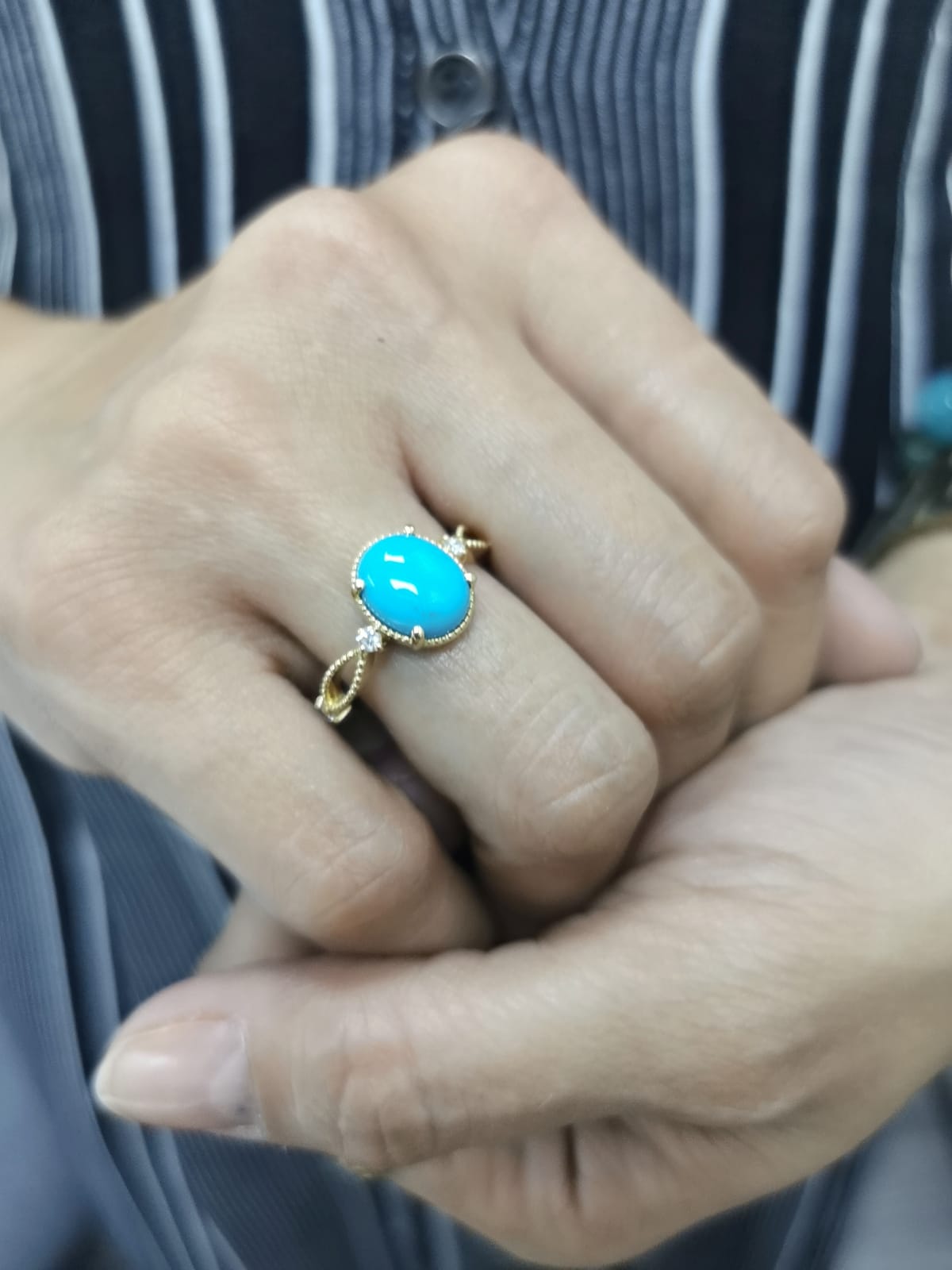 18K gold oval turquoise ring with diamond accents and vintage milgrain openwork design