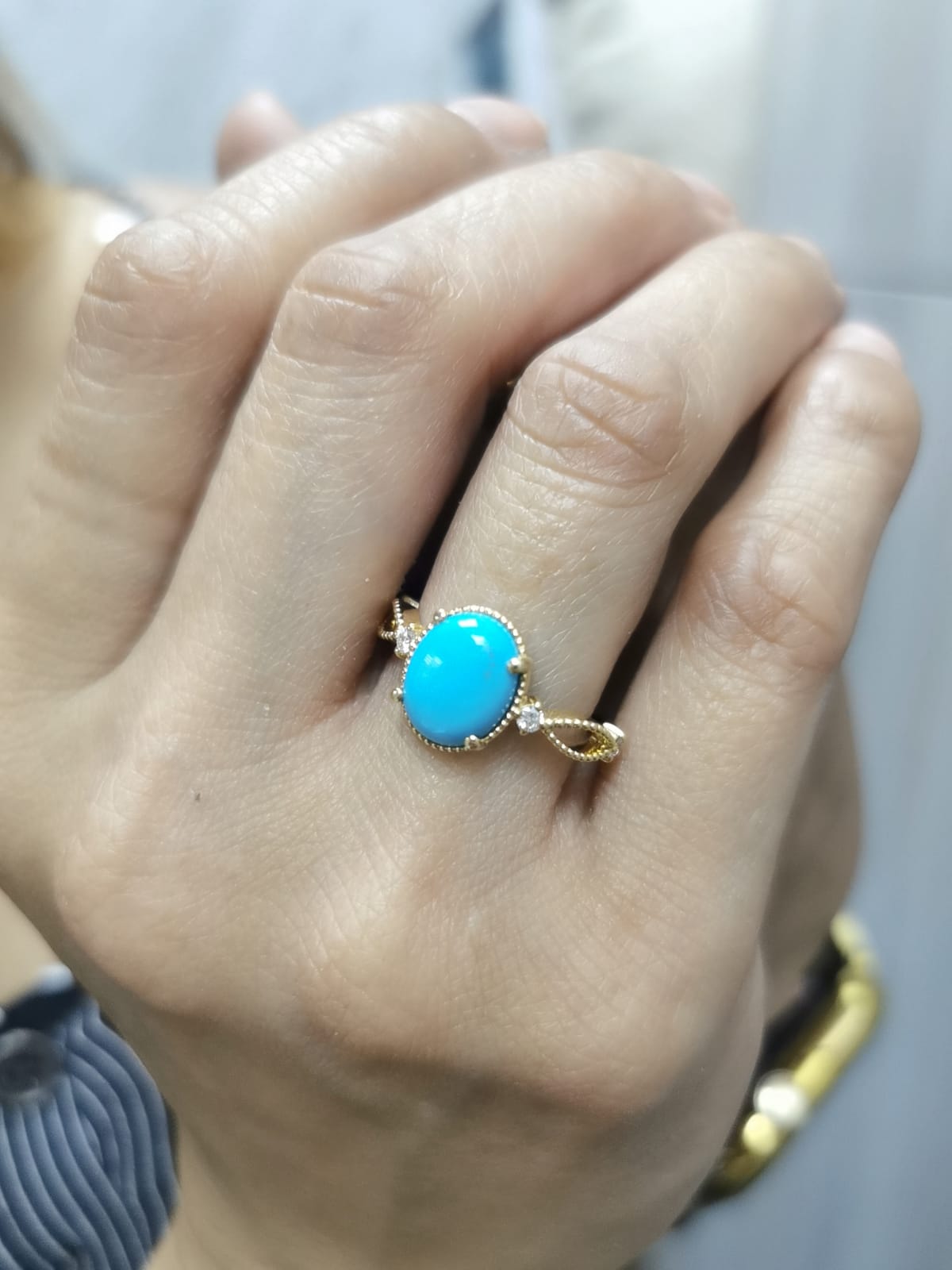 18K gold oval turquoise ring with diamond accents and vintage milgrain openwork design
