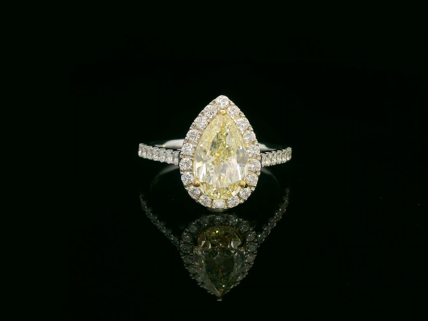 18K white gold ring with IGI certified 2.15ct pear-shaped fancy yellow diamond and 0.50ct white diamond halo