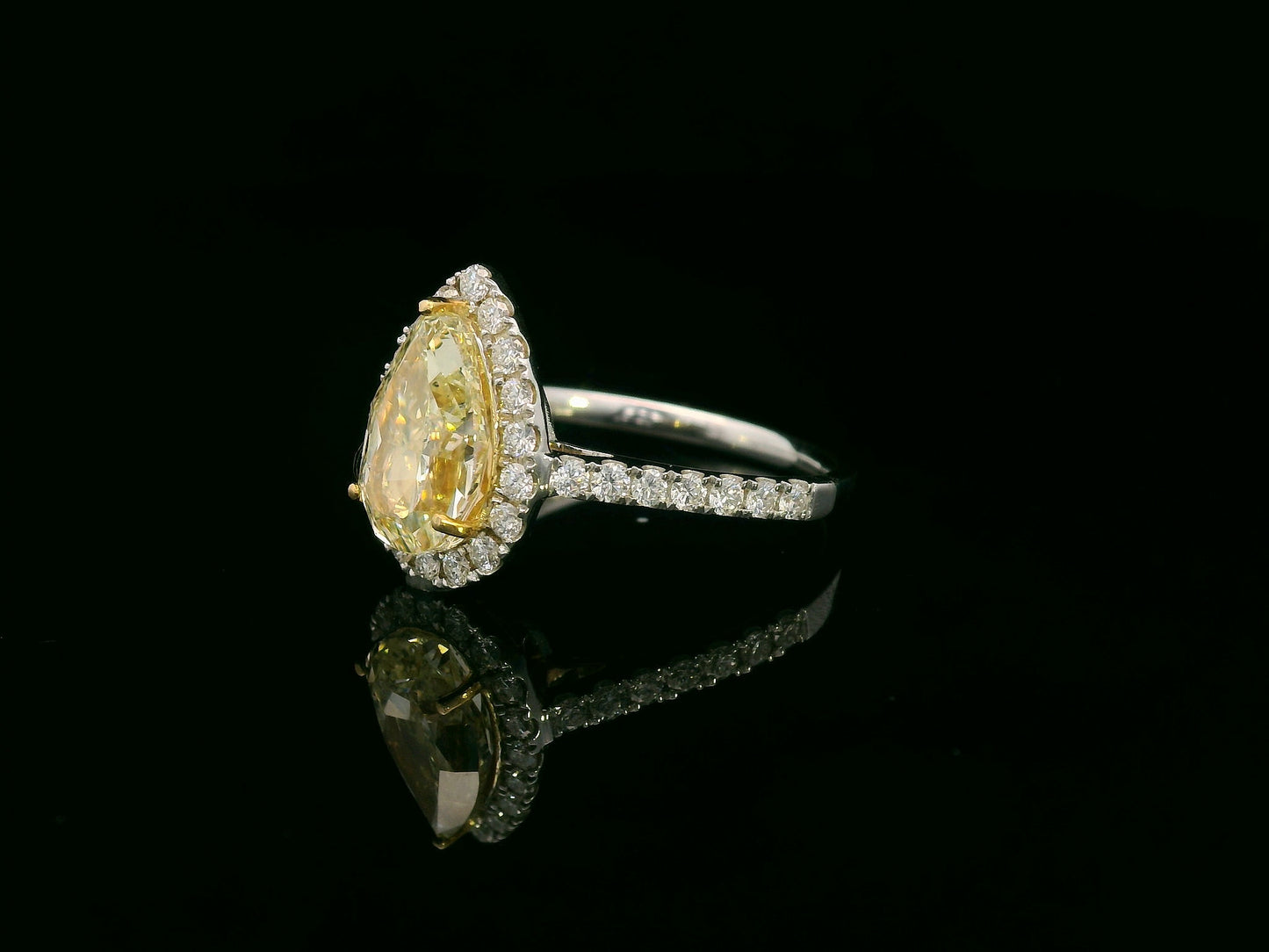 18K white gold ring with IGI certified 2.15ct pear-shaped fancy yellow diamond and 0.50ct white diamond halo