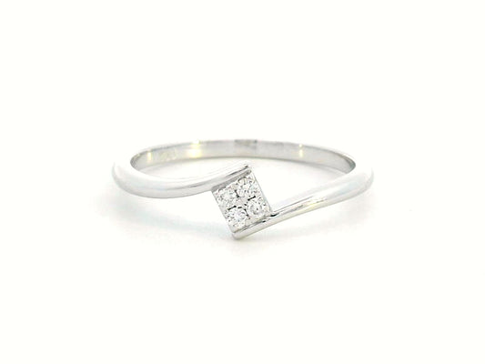 Minimalist 18K gold bypass ring with 0.06 carat total diamond weight, featuring a sleek modern design and geometric diamond setting.