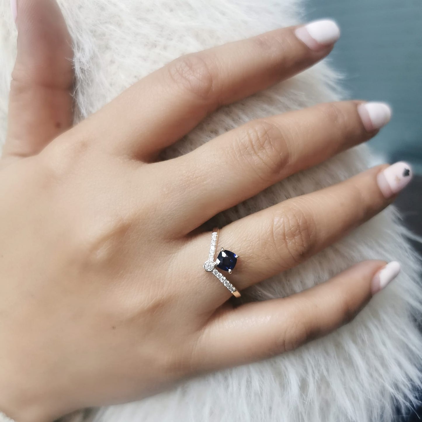18K gold blue sapphire and diamond ring featuring a 0.51 carat cushion-cut sapphire and 0.14 carats of round-cut diamonds, set in an elegant design. Perfect for special occasions and fine jewelry lovers
