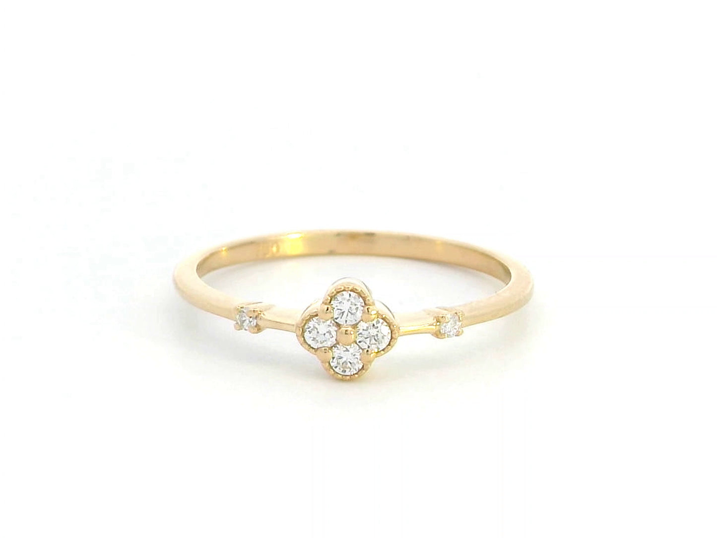 Minimalist 18K gold diamond clover ring with 0.12 carat total weight, featuring a delicate band and modern, elegant design.