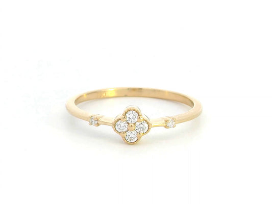 Minimalist 18K gold diamond clover ring with 0.12 carat total weight, featuring a delicate band and modern, elegant design.