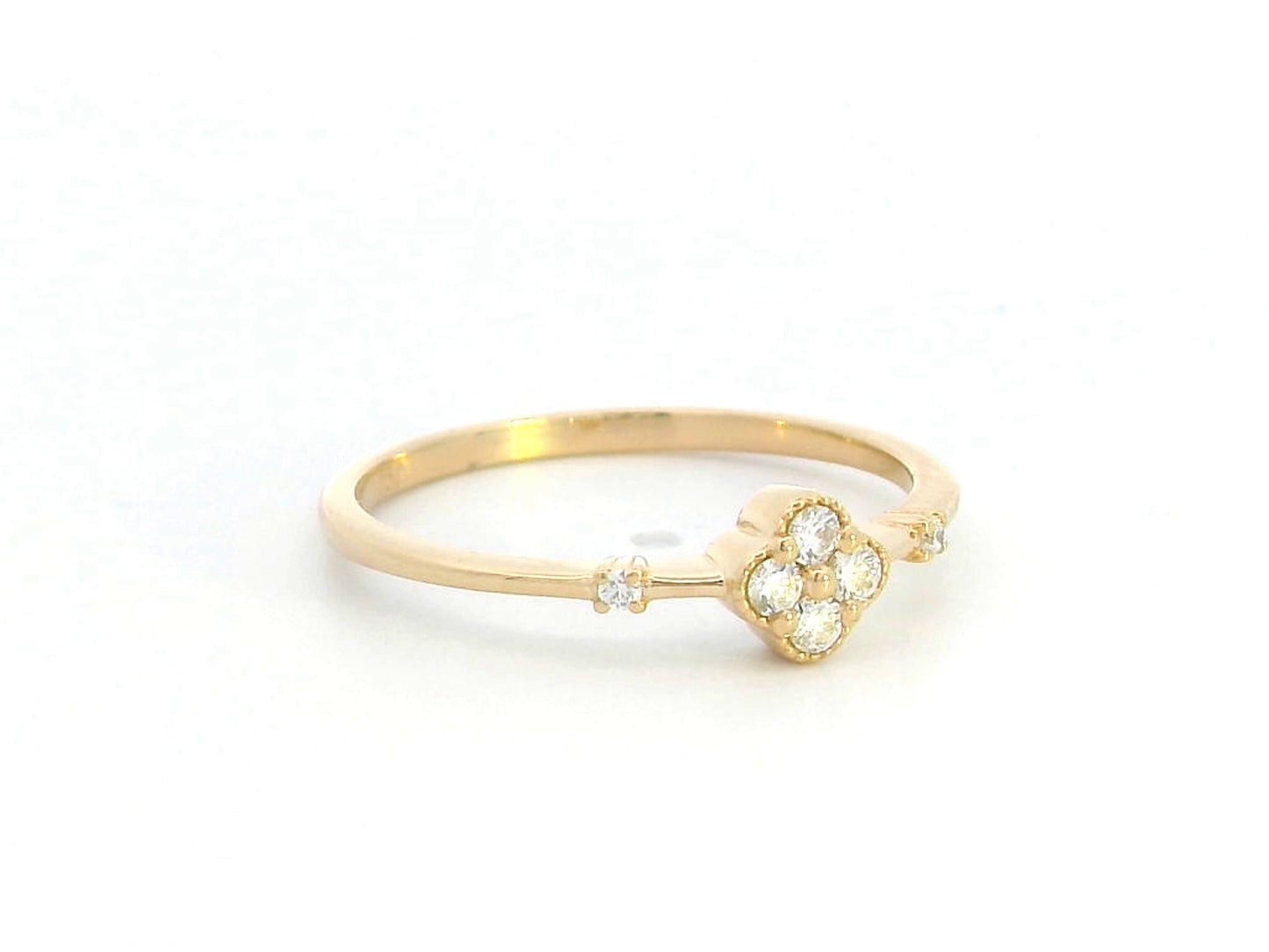 Minimalist 18K gold diamond clover ring with 0.12 carat total weight, featuring a delicate band and modern, elegant design.