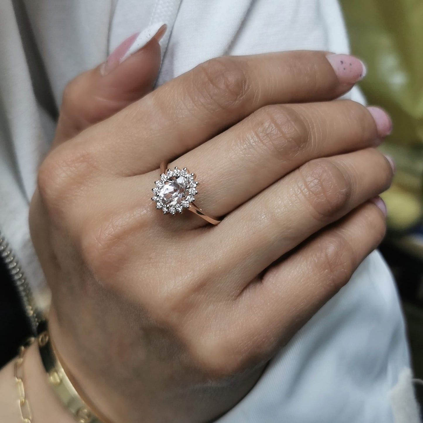 18K rose gold oval morganite ring with floral diamond halo, featuring a 1.57ct morganite and 0.29ct diamonds,