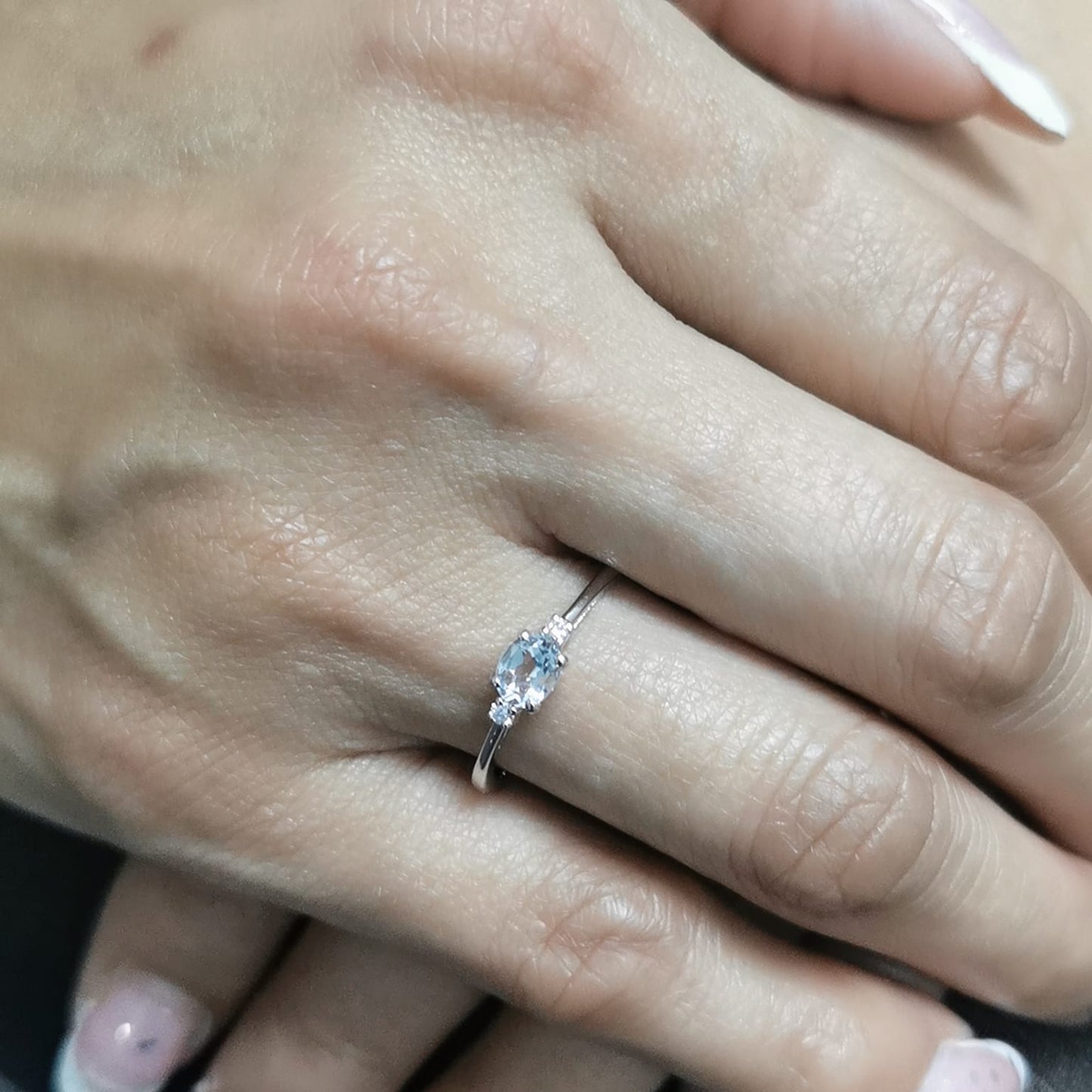 Minimalist oval aquamarine and diamond ring in 18K gold – March birthstone ring.