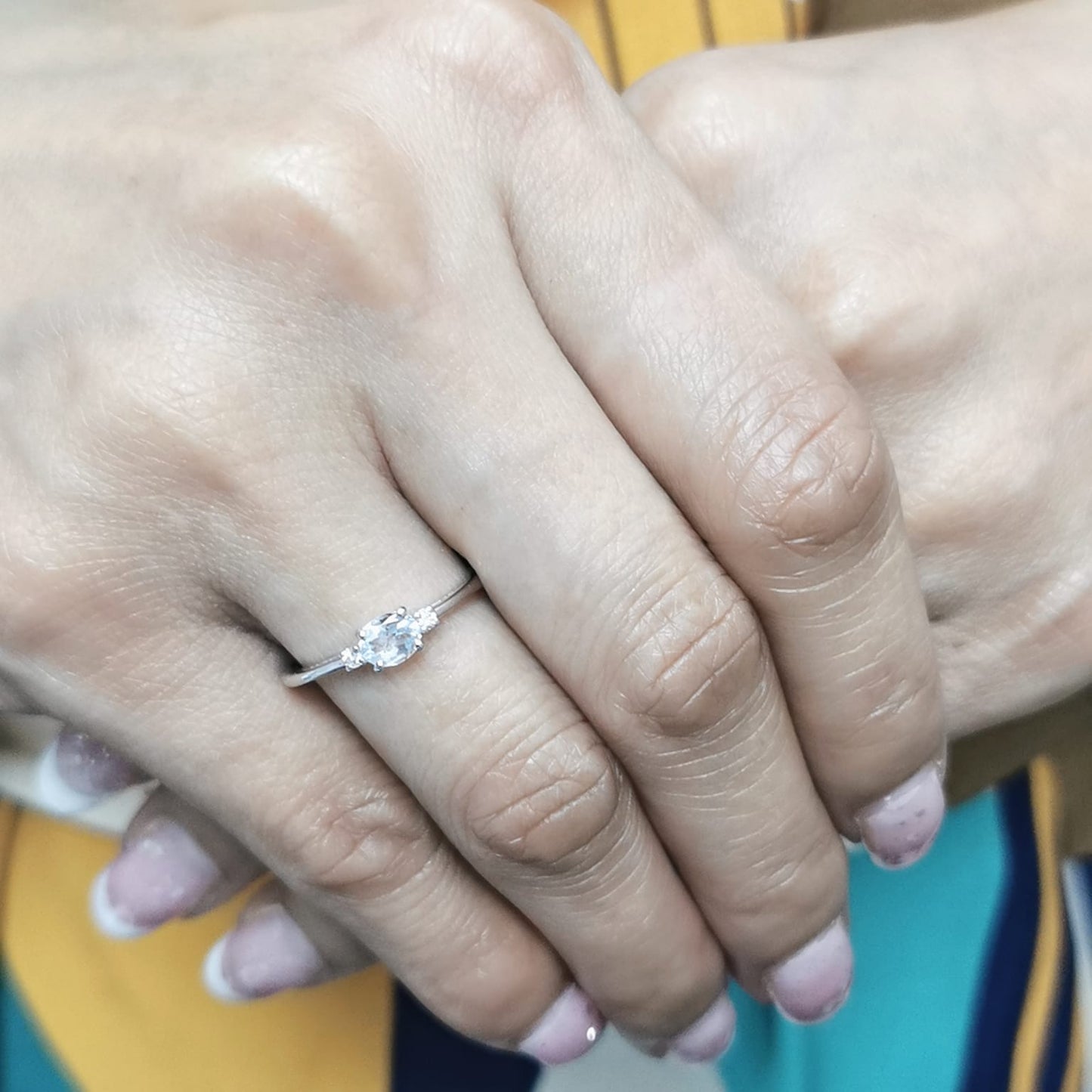 Minimalist oval aquamarine and diamond ring in 18K gold – March birthstone ring.
