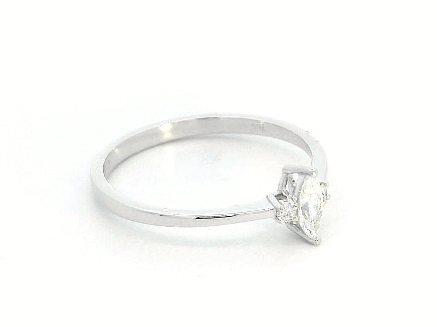 18K gold marquise diamond ring featuring a 0.19-carat marquise-cut center stone with 0.04-carat round diamond accents. Perfect as an engagement ring, stacking ring, or elegant everyday jewelry