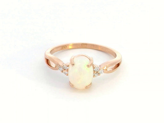 Elegant 18K gold Opal and diamond ring, 1.11-carat Opal with 0.06-carat diamond accents, October birthstone jewelry.